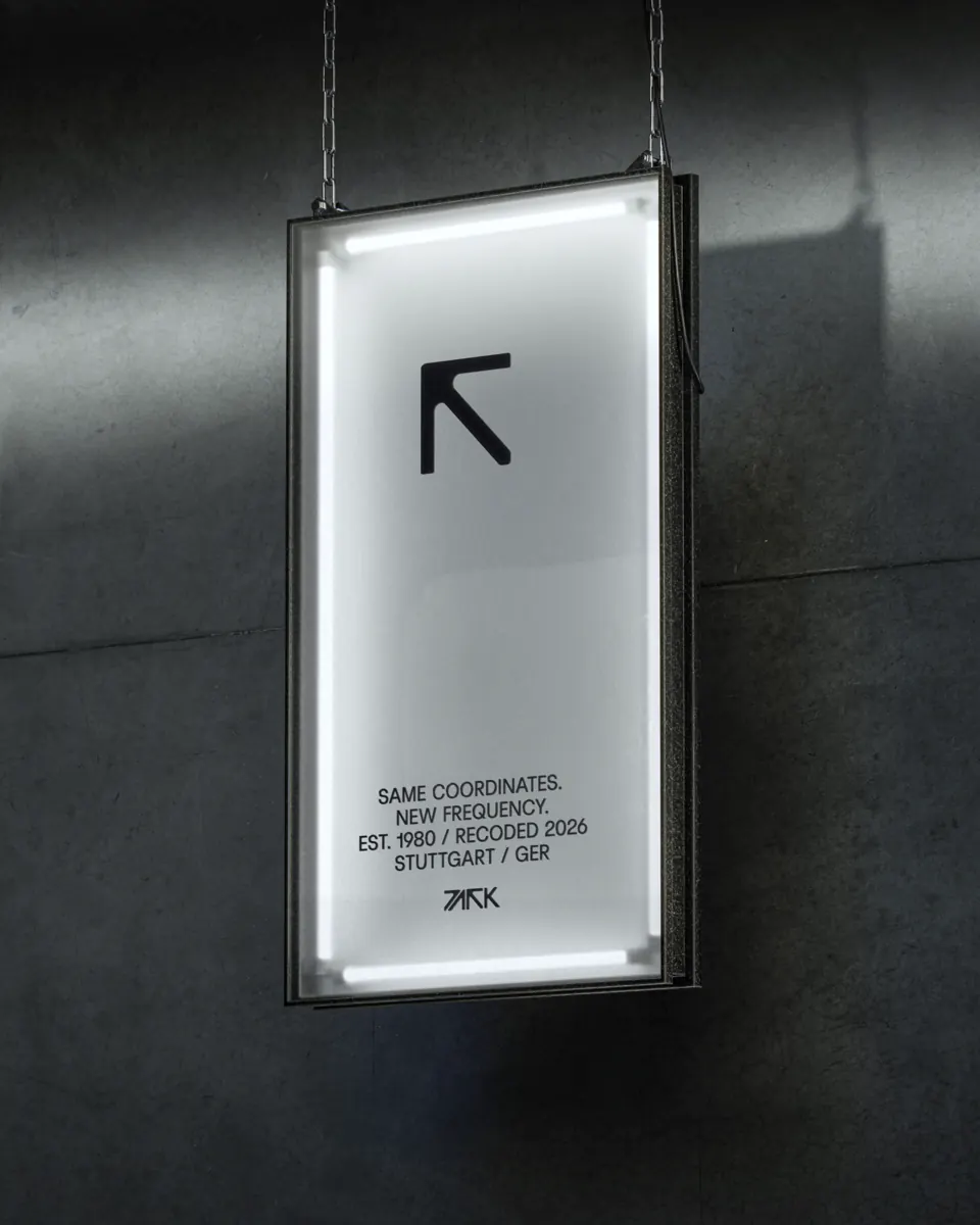 Leuchtkasten am Eingang: Same coordinates. New frequency. Est. 1980 / Recoded 2026